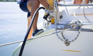 what safety precaution should you take while filling the fuel tank of a gasoline-powered boat